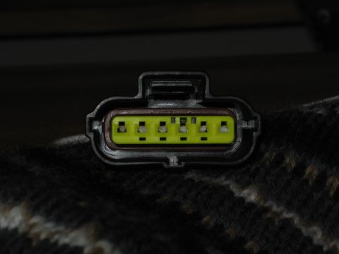 2000 Ford Crown Victoria - Electrical connector with six pins, likely a vehicle component.