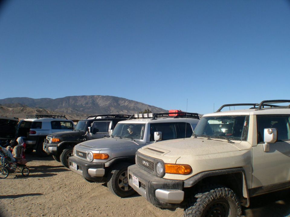 Tan 2007 Toyota FJ Cruiser in a line of similar vehicles