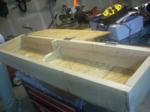 1992 Ford Bronco - A custom-built wooden storage box with a hinged lid is shown in a garage setting.