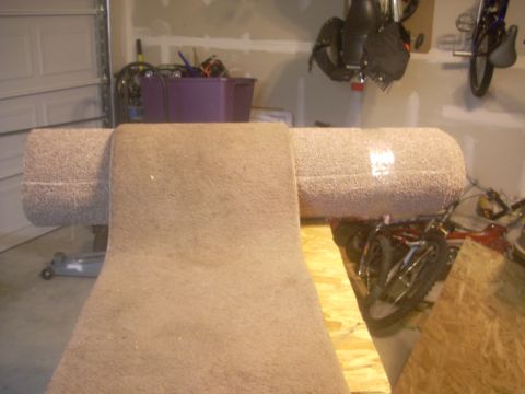 1992 Ford Bronco - This carpeted storage area, likely from a vehicle's interior, is visible with a Supermotors.net logo in the lower right corner.