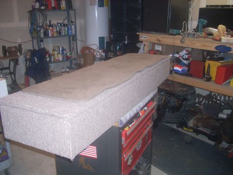 1992 Ford Bronco - A custom-built storage box, likely for a vehicle's cargo area, sits on a toolbox in a cluttered garage.