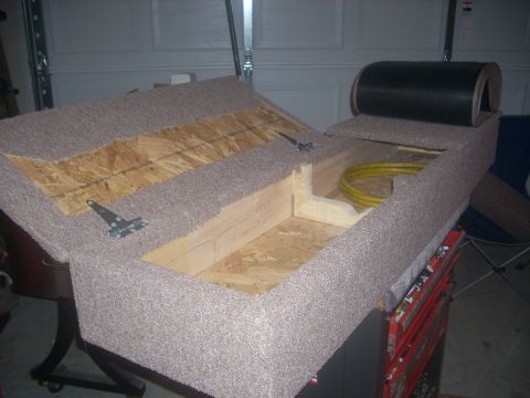 1992 Ford Bronco - This custom-built storage compartment appears to be designed for a vehicle's interior, possibly behind the seats, carpeted surfaces and int…