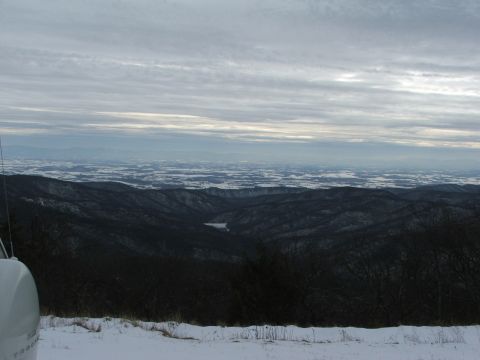 1996 Ford Bronco - Expansive view of a winter landscape with rolling hills and a cloudy sky.