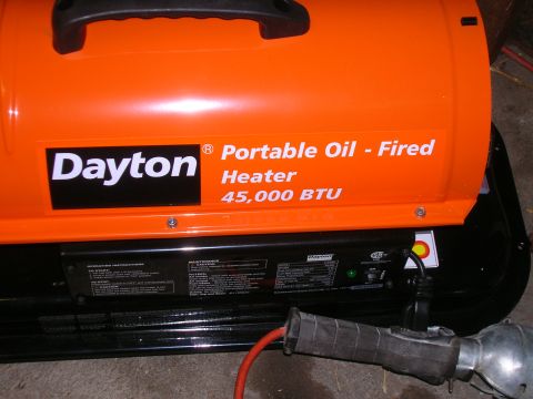 1979 Ford Bronco - An orange Dayton portable oil-fired heater is shown with its specifications and operating instructions visible.