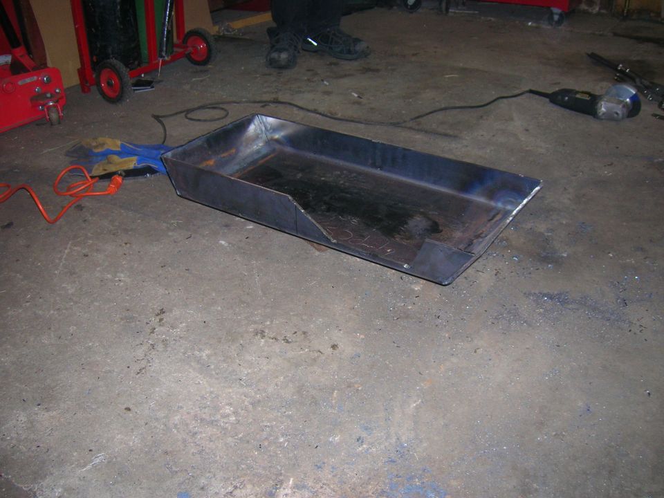 Fabricated metal pan with cut-out corner