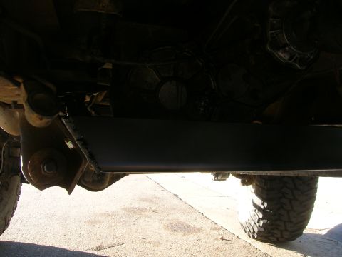 1979 Ford Bronco - Close-up view of a vehicle's undercarriage, showing suspension components and a tire. The Supermotors.net logo is visible in the lower righ…