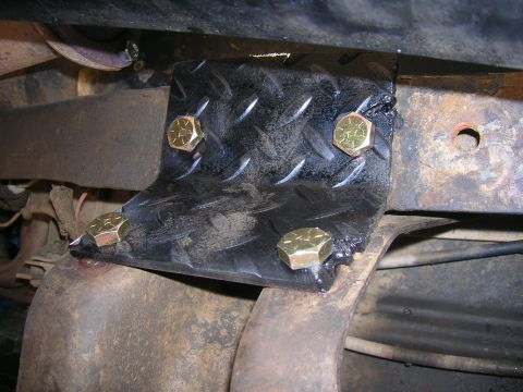 1979 Ford Bronco - Custom bracket installation on vehicle frame, showing bolted connection points.