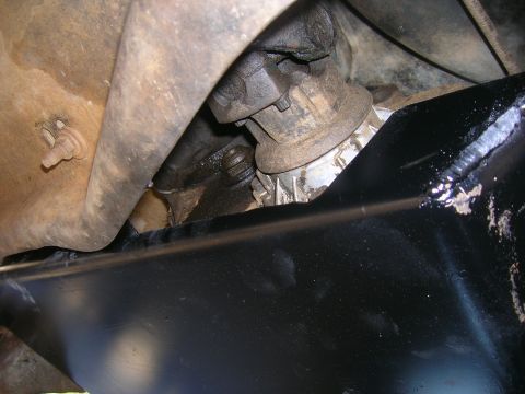 1979 Ford Bronco - Underside view of a vehicle's driveline, showing a u-joint and part of the driveshaft.