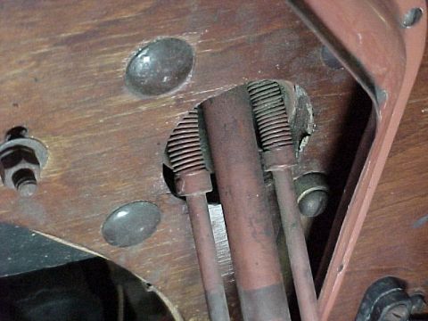 1912 Ford Model T - Detail of mechanical linkage components, possibly from an older vehicle's interior or firewall.