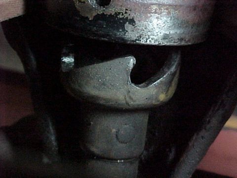 1912 Ford Model T - A close-up view of a vehicle's suspension system component, showing wear and metal construction.