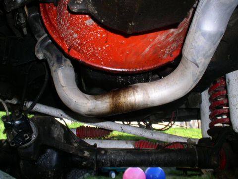 1979 Ford Bronco - Close-up view of the undercarriage, showing exhaust and suspension parts.