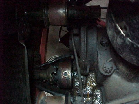 1912 Ford Model T - Detail of a vehicle's drivetrain, showing a universal joint and associated components.