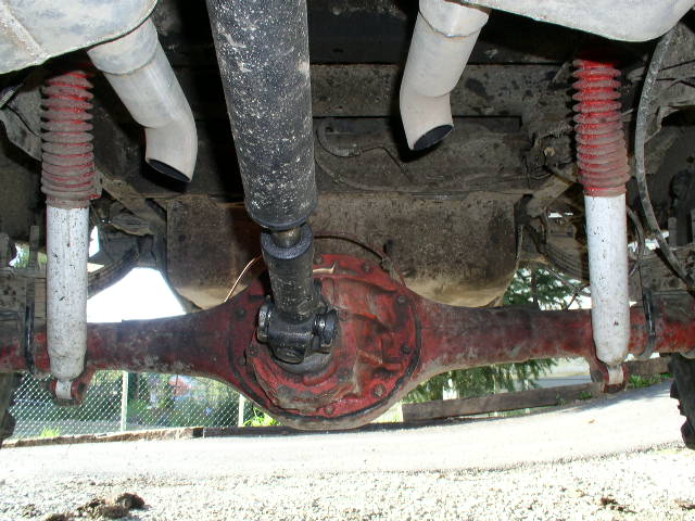 Underside view of rear differential and red shocks