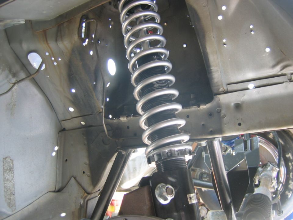 Front suspension coilover shock absorber with silver spring and black adjustable body