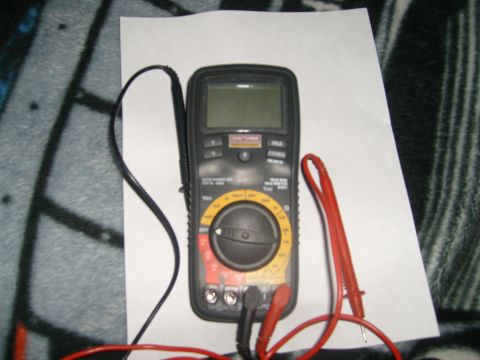 1993 Ford Bronco - A Craftsman multimeter is shown with its red and black probes connected.