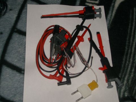 1993 Ford Bronco - A collection of electrical test leads and an adapter plug are laid out on a white surface.