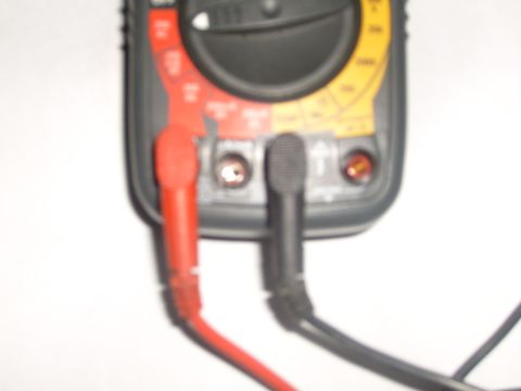 1993 Ford Bronco - A digital multimeter with attached probes is shown against a white background.