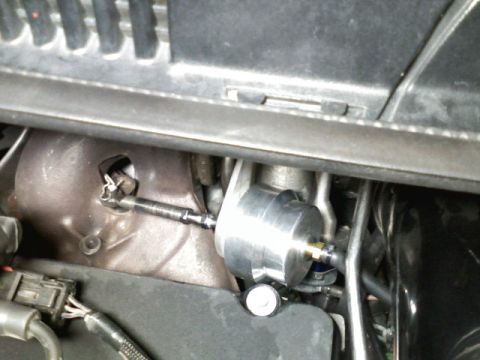 1996 Ford Probe - Detail of a turbocharger wastegate actuator assembly, likely in an engine bay.