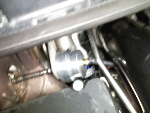 1996 Ford Probe - A close-up view of an engine part, possibly a blow-off valve or boost controller, with attached hoses.