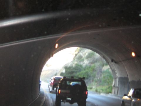 1996 Ford Bronco - Traffic moves through a tunnel, with several vehicles visible ahead and to the side.