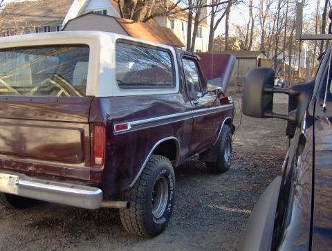 1996 Ford Bronco - This 1978 Ford Bronco has a two-tone paint scheme and its hood is open.