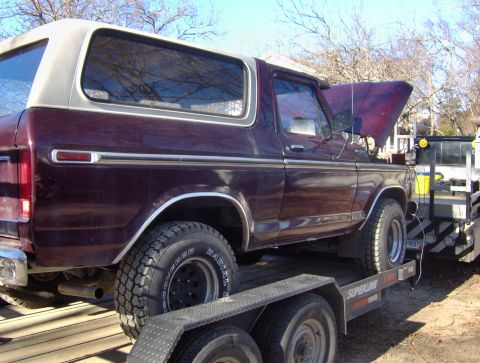 1996 Ford Bronco - This maroon Ford Bronco, likely a 1978 model, is seen on a trailer with its hood open.
