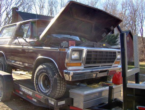 1996 Ford Bronco - This Ford Bronco is on a trailer with its hood open.