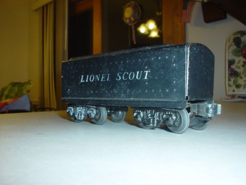 2000 Ford Crown Victoria - A black Lionel Scout train car is shown from the side, resting on a flat surface.