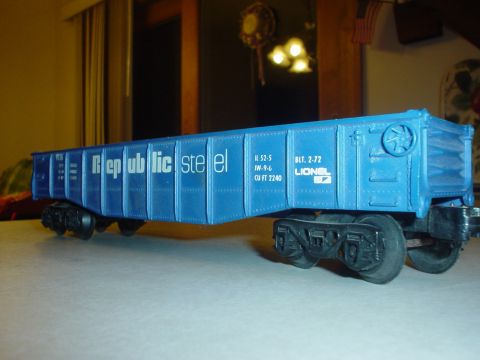 2000 Ford Crown Victoria - A blue Lionel train car, likely a model, is shown with visible text and markings.