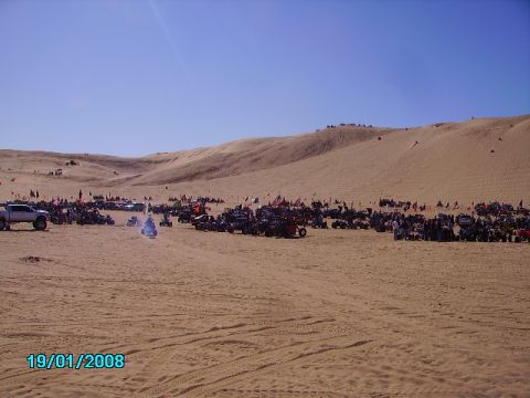 1990 Ford Bronco - A large gathering of off-road vehicles and dune buggies in a desert area on January 19, 2008.