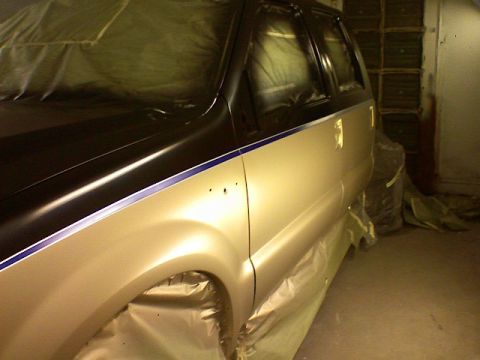 1991 Ford Bronco - This SUV is being prepped for a new paint job, with protective coverings applied to the windows and body panels.