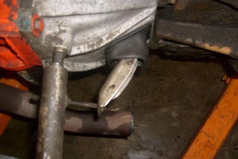 1979 Chevrolet Blazer - A close-up view of a vehicle's differential housing and associated components, with an orange jack in the background.