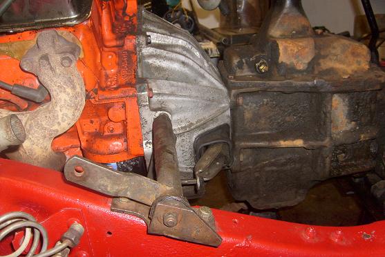 Close-up of engine block, exhaust manifold, and transmission housing with red frame visible