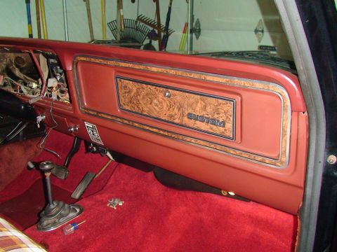 1979 Ford F-150 - Interior view of a 1979 Ford F-150, highlighting the dashboard's woodgrain panel and 'CUSTOM' trim.