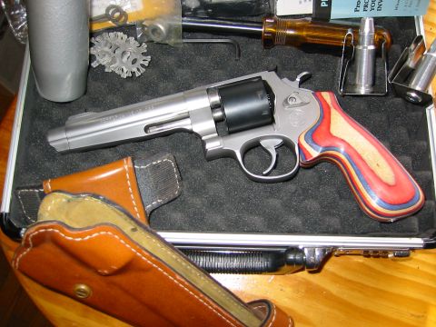 1996 Ford Bronco - A revolver handgun with a leather holster and ammunition is displayed in a case.