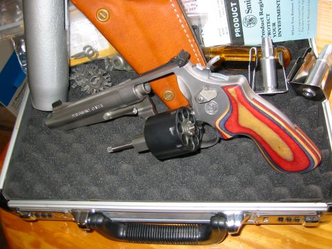 1996 Ford Bronco - Smith & Wesson revolver with custom grips and ammunition, presented in a fitted case.