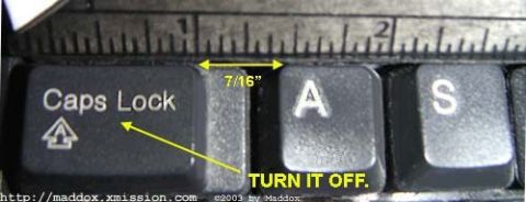 1979 Ford Bronco - A ruler measures the space between keyboard keys, with an arrow pointing to the Caps Lock key.