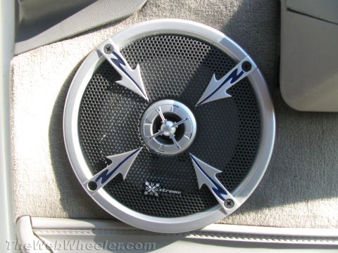 1994 Chevrolet Silverado 3500 - Aftermarket speaker with a distinctive design, silver trim and blue arrow accents, and the 'Xtreme' branding.