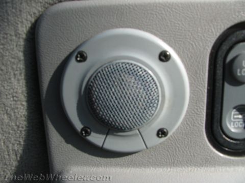 1994 Chevrolet Silverado 3500 - Interior shot of a vehicle's door panel, a speaker and power window controls.