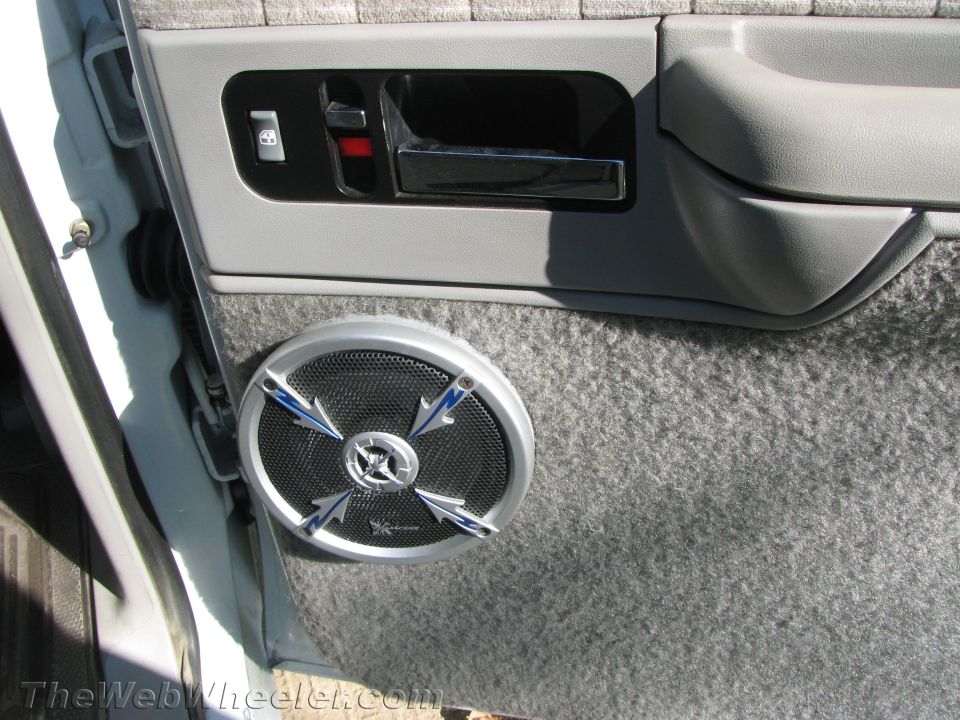 Interior door panel with aftermarket speaker and chrome door handle. 1994 Chevrolet Silverado 3500