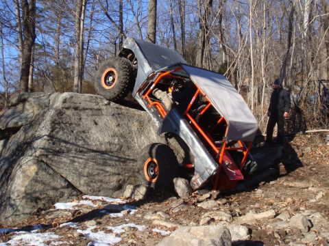 1978 Ford Bronco - This heavily modified off-road buggy navigates a challenging rocky incline.
