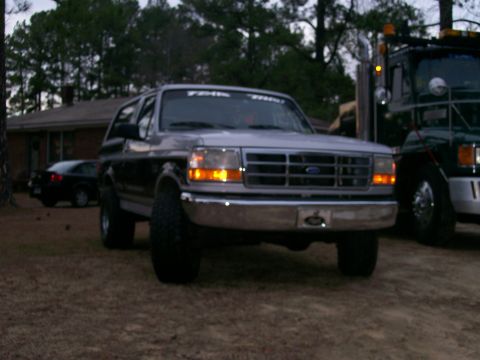 1996 Ford Bronco - This 1996 Ford Bronco is seen parked outdoors next to a tow truck.