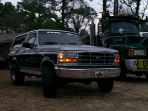 1996 Ford Bronco - 1996 Ford Bronco in front of a tow truck.