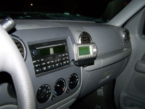 2004 Ford Expedition - Interior view of a 2004 Ford Expedition dashboard, showing the radio and an attached GPS device.