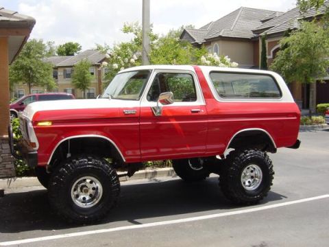 1978 Ford Bronco - This lifted 1978 Ford Bronco is painted red with a white top and large off-road tires.