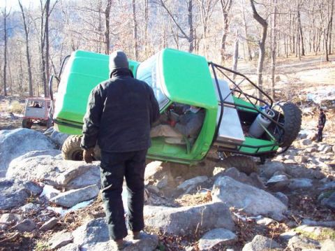 1978 Ford Bronco - An off-road vehicle has tipped over while navigating a challenging rocky terrain.