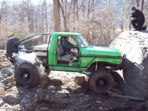 1978 Ford Bronco - This 1978 Ford Bronco is navigating a difficult rocky terrain, kicking up dust and smoke.