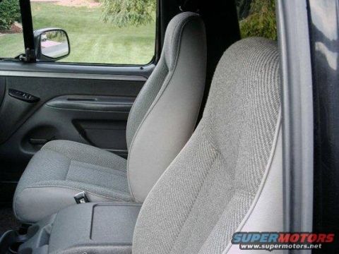 1986 Ford Bronco - Front seats and door panel visible inside a truck cab.