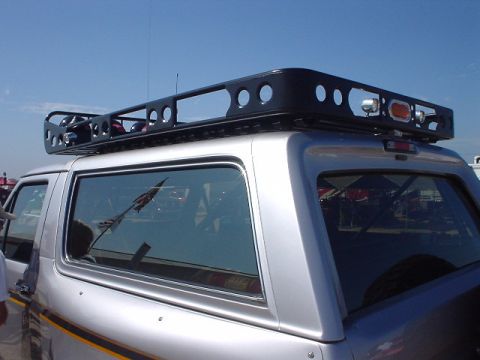 1986 Ford Bronco - Third generation Ford Bronco side view, equipped with a roof rack.