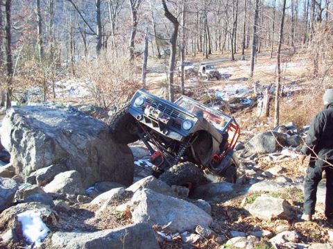 1978 Ford Bronco - This 1978 Ford Bronco is tackling a challenging off-road course with large boulders.